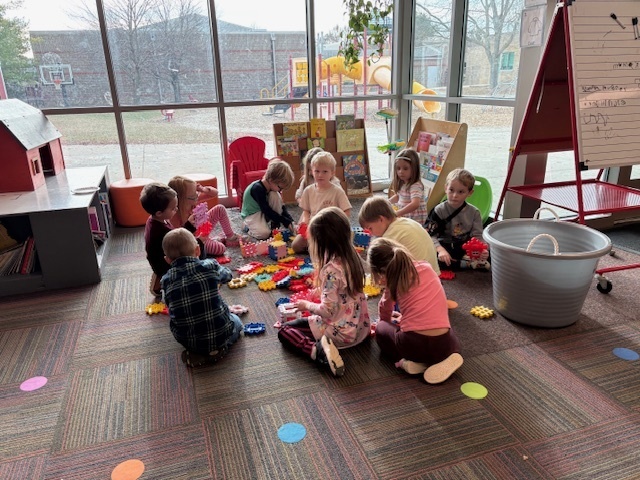 Students playing with blocks as a school reward.