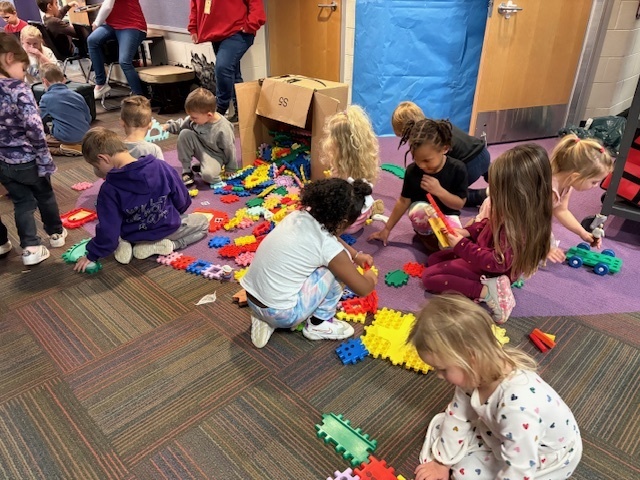 Students playing with blocks as a school reward.