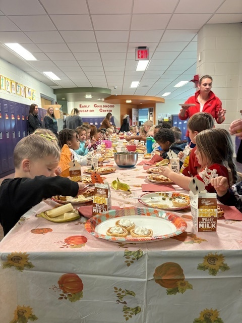 Preschool students enjoying their Friendsgiving meal.