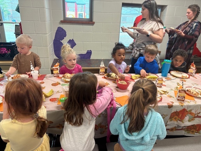 Preschool students enjoying their Friendsgiving meal.