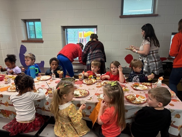 Preschool students enjoying their Friendsgiving meal.