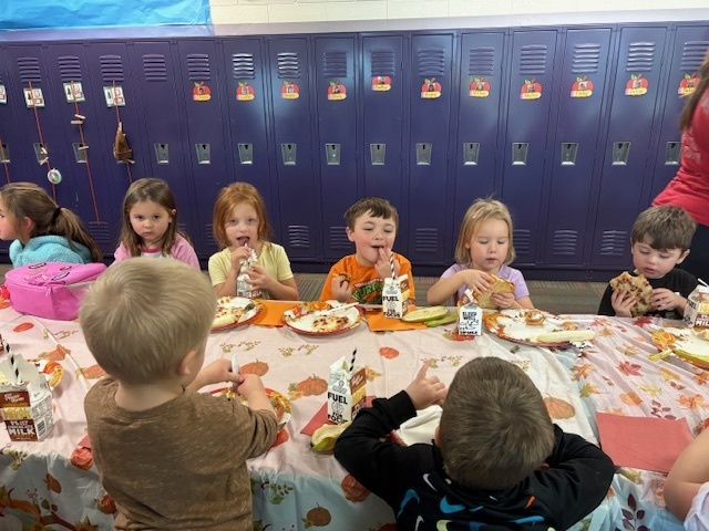 Preschool students enjoying their Friendsgiving meal.