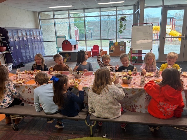 Preschool students enjoying their Friendsgiving meal.