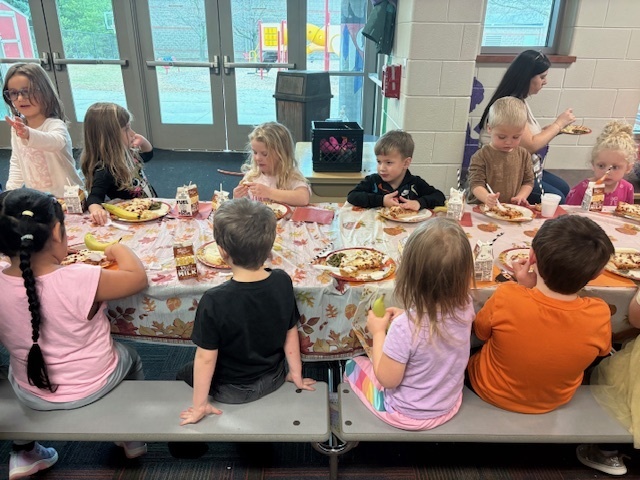 Preschool students enjoying their Friendsgiving meal.