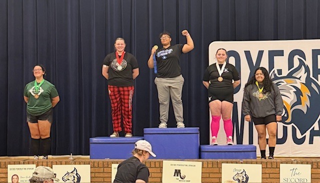 Kali on the podium with winners