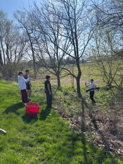Students picking up trash at the park