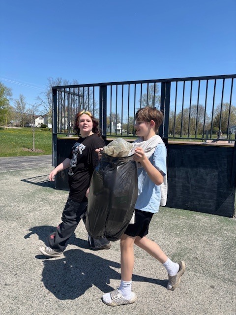 Students picking up trash at the park