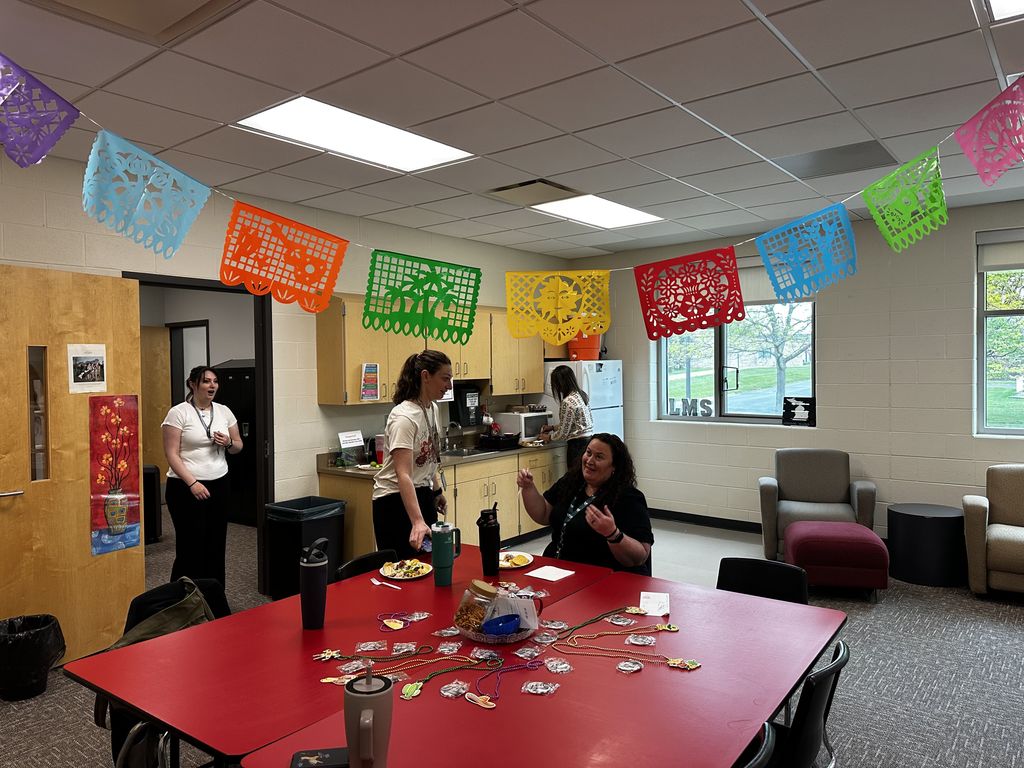 Teachers enjoying lunch in the lounge
