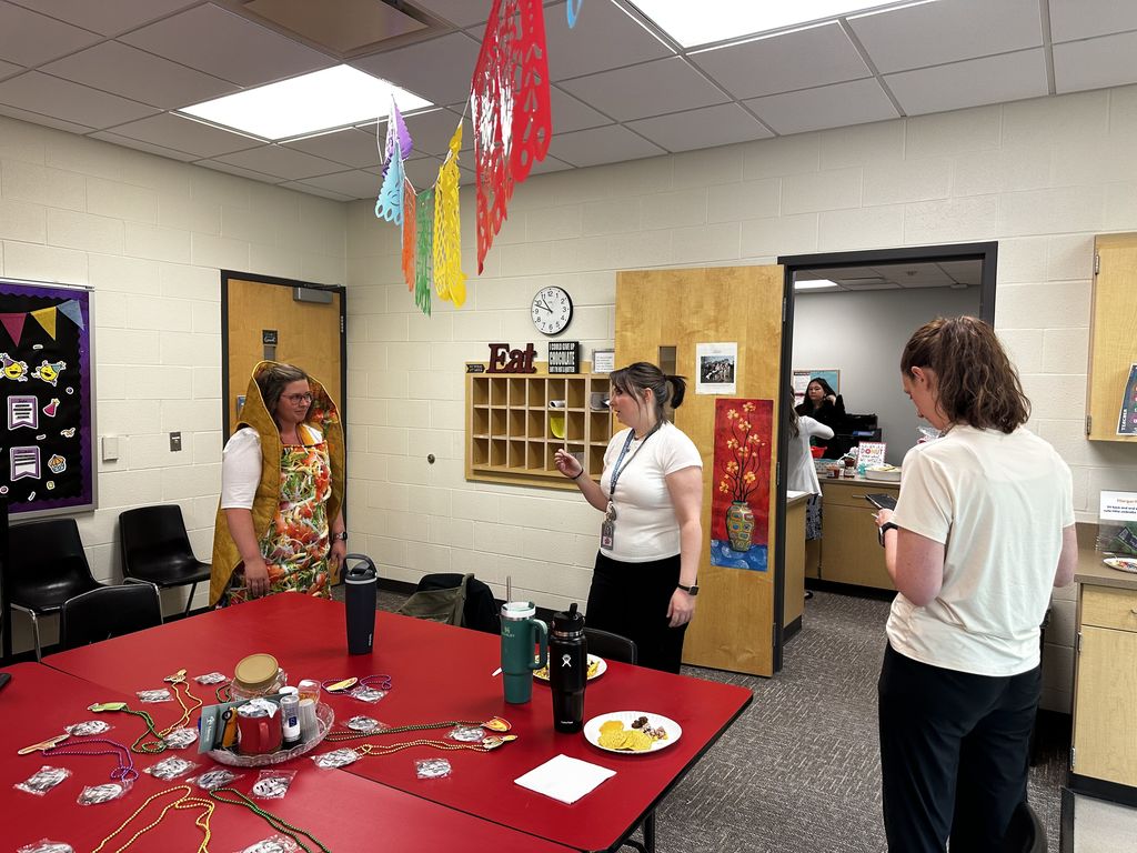 Teachers enjoying lunch in the lounge