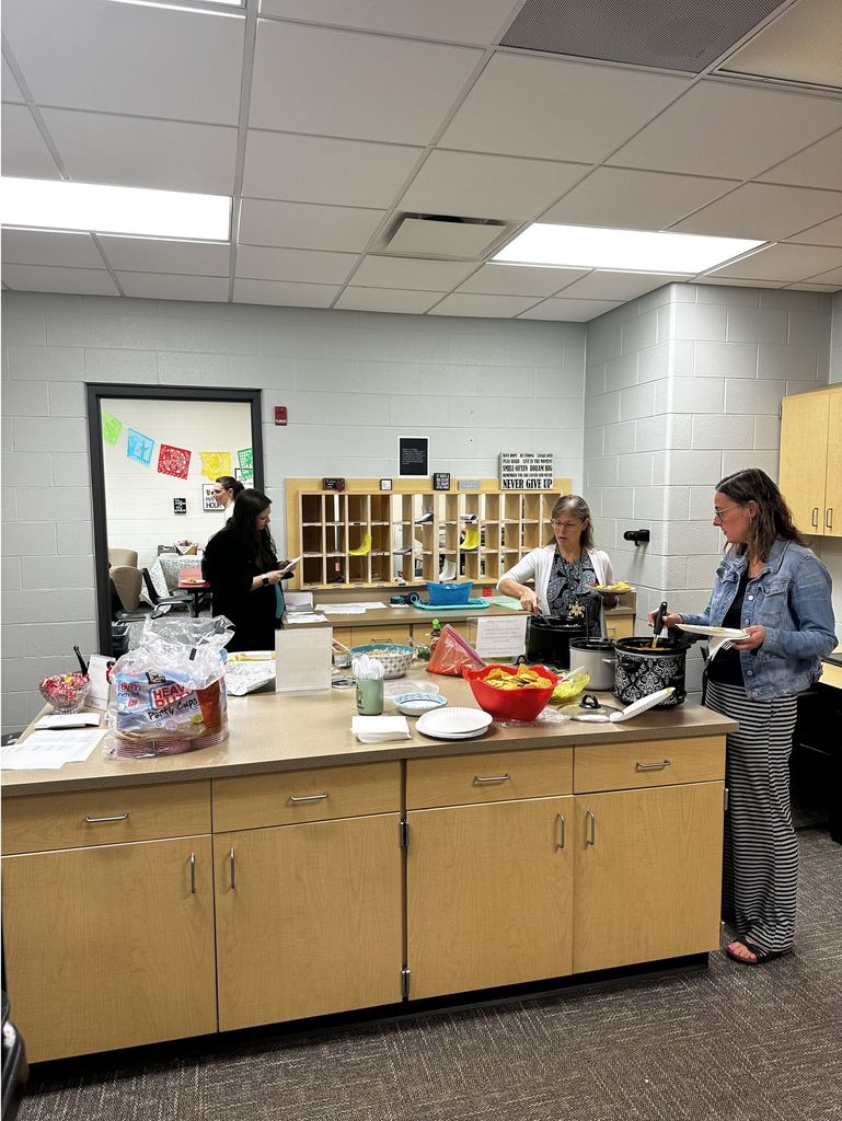 Teachers enjoying lunch in the lounge