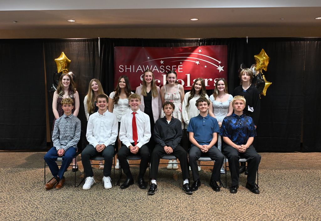 Students posed in front of Shiawassee Scholar banner