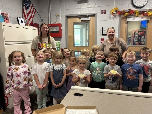 Ms. Cora's yellow room shared popcorn that they have made with the office!