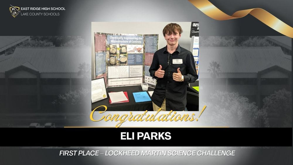 Male student in front of science project. Wording says, "Congratulations Eli Parks, Regional First Place -- Lockheed Martin Science Challenge"