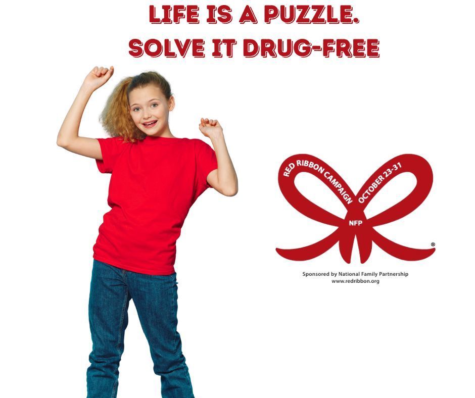 Girl in red shirt and jeans posed for camera. Wording says Life is a Puzzle. Solve it Drug-Free. 