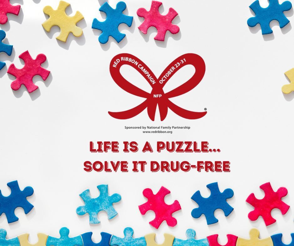 Multi-colored puzzle pieces around the perimeter of wording that says Life is a Puzzle. solve it Drug-Free. 