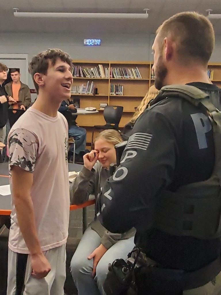 Representatives from Umatilla Police Department and Mount Dora Police Department speak at the UHS Bulldog Student Union as part of the  Career Talk series where students learn about real careers in the area.