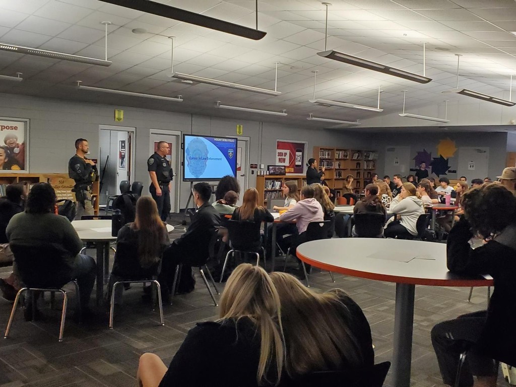 Representatives from Umatilla Police Department and Mount Dora Police Department speak at the UHS Bulldog Student Union as part of the  Career Talk series where students learn about real careers in the area.