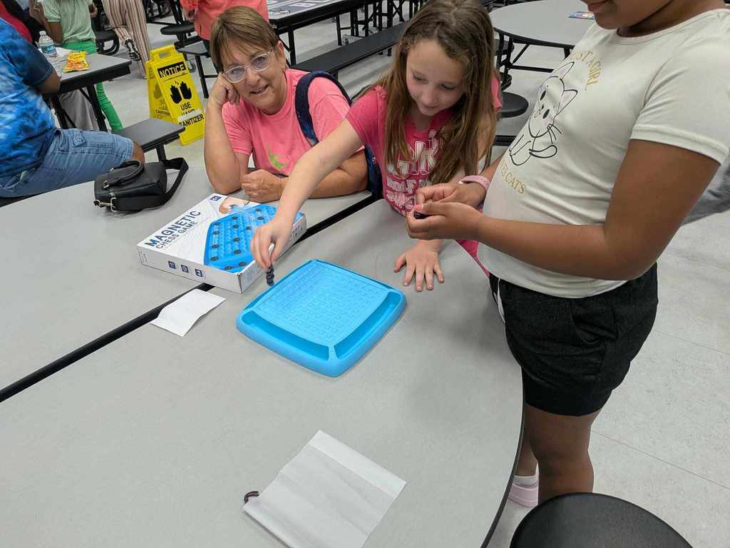 family and friends figuring out how to play the magnetic game