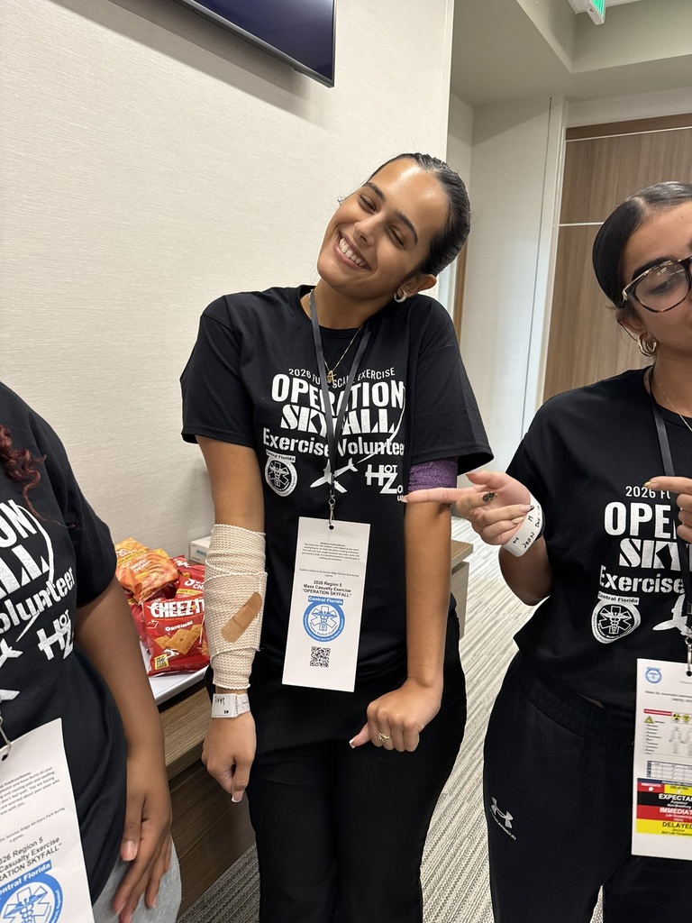 Student enactor poses with arm in a bandage