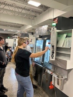 Students looking at a large computer screen