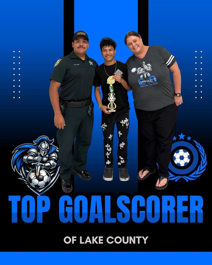Adbiel with his coaches after receiving his trophy