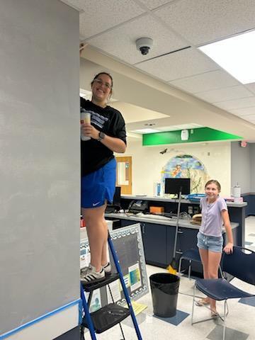 Mount Dora Lowes supports Triangle Elementary with paint, supplies, and volunteers to redo our front office