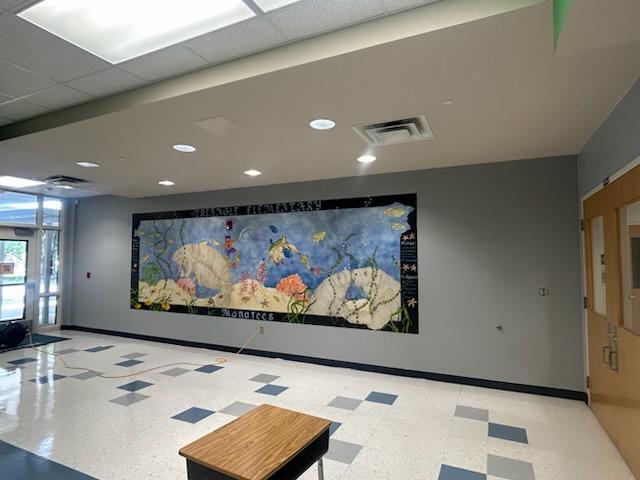 Mount Dora Lowes supports Triangle Elementary with paint, supplies, and volunteers to redo our front office