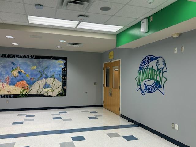 Mount Dora Lowes supports Triangle Elementary with paint, supplies, and volunteers to redo our front office