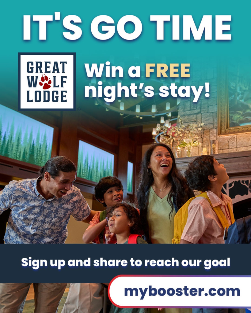 Promotional graphic showing an excited family looking up inside a Great Wolf Lodge lobby. Text reads: "It's Go Time. Win a FREE night's stay! Sign up and share to reach our goal at mybooster.com."