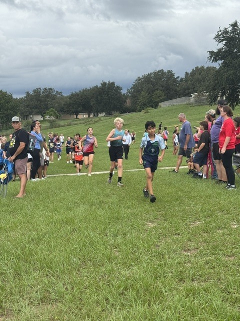 Pictures of Cross Country Meet, athletes running the course 