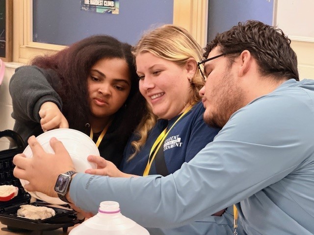 3 students working together on a project