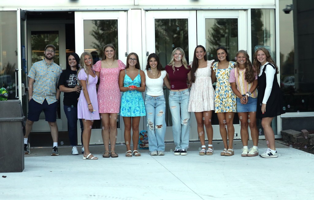 Student council members greeting students
