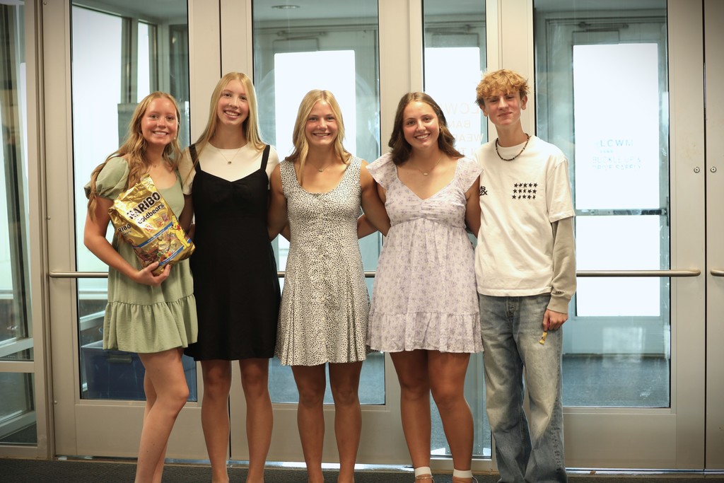 Student council members greeting students