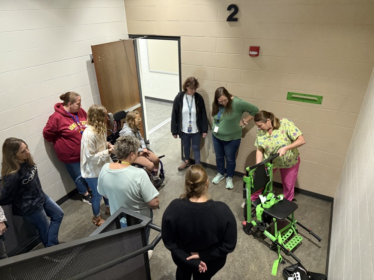 paras practicing using the striker evacuation wheelchair 