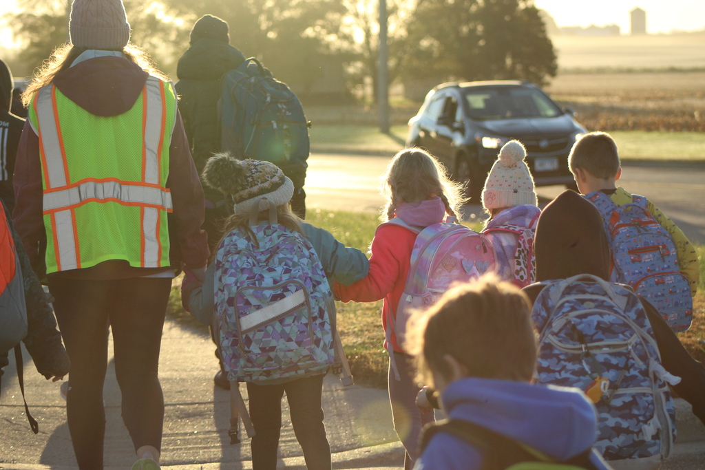Students walking hand in hand to the elementary