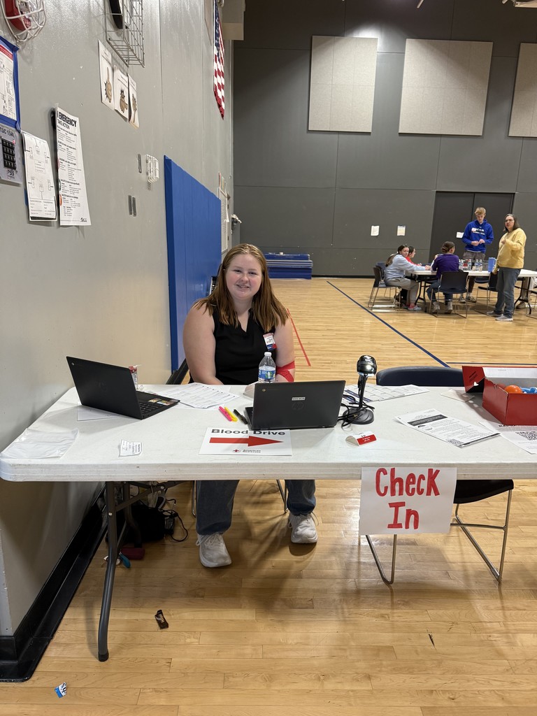Student waiting at the blood drive check in table.