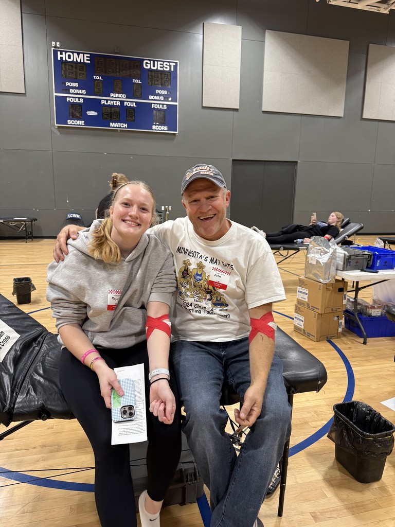 Dad and daughter together after donating blood.