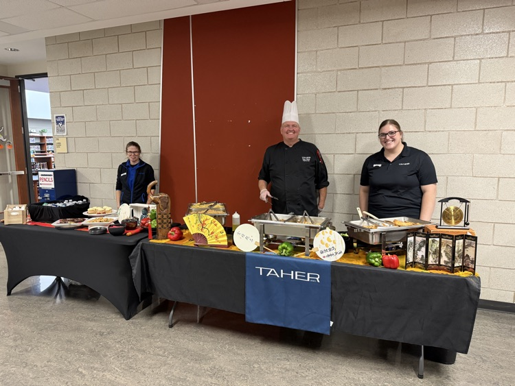 Chef Tony, Amber and Sharona serving the board a Mongolian grill meal