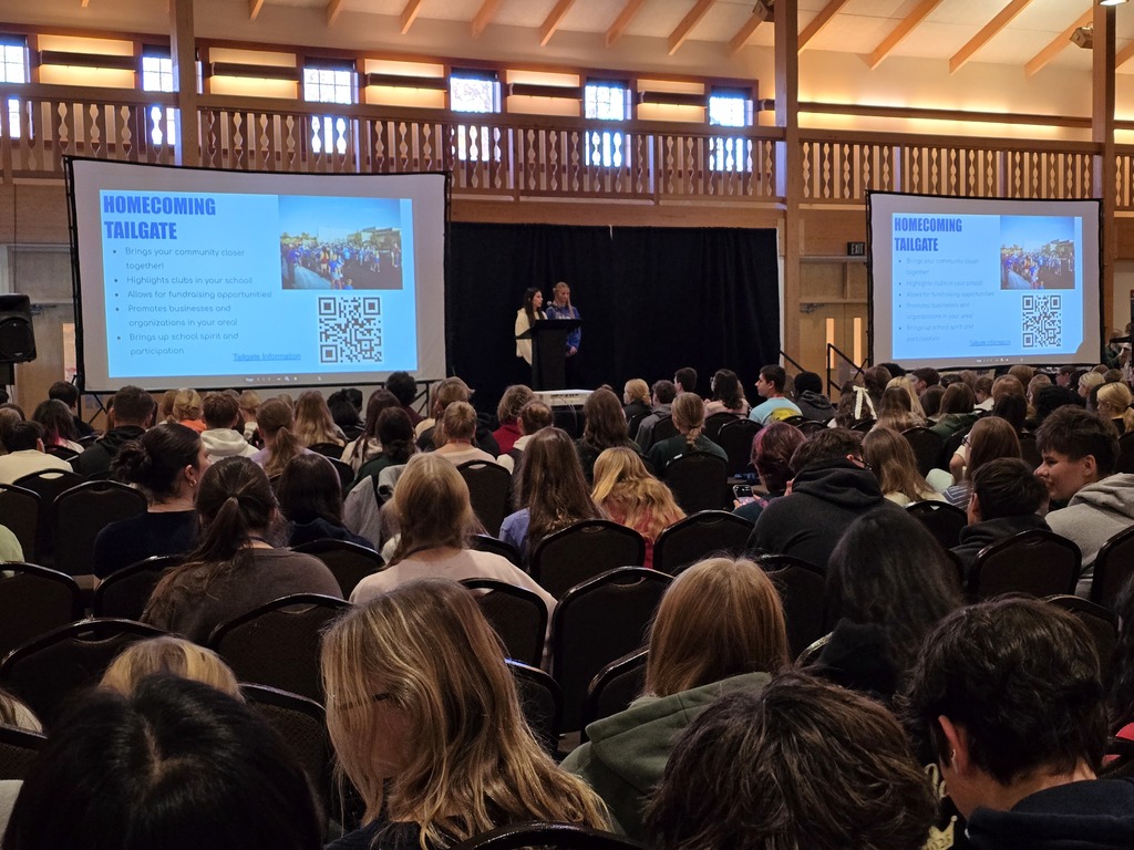 Two LCWM students presenting on the heomcoming tailgate event that the student council puts on annually.