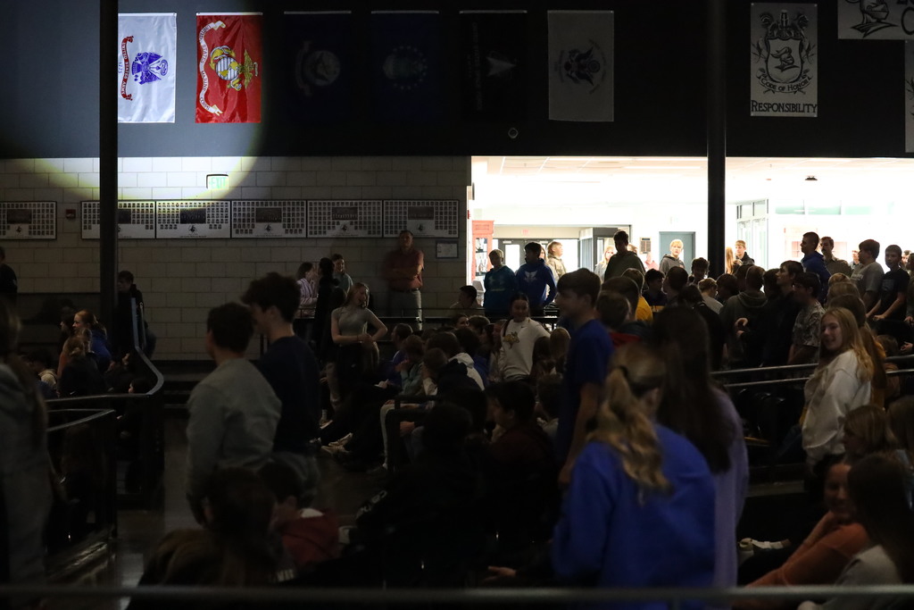 students standing during the armed forces medley.