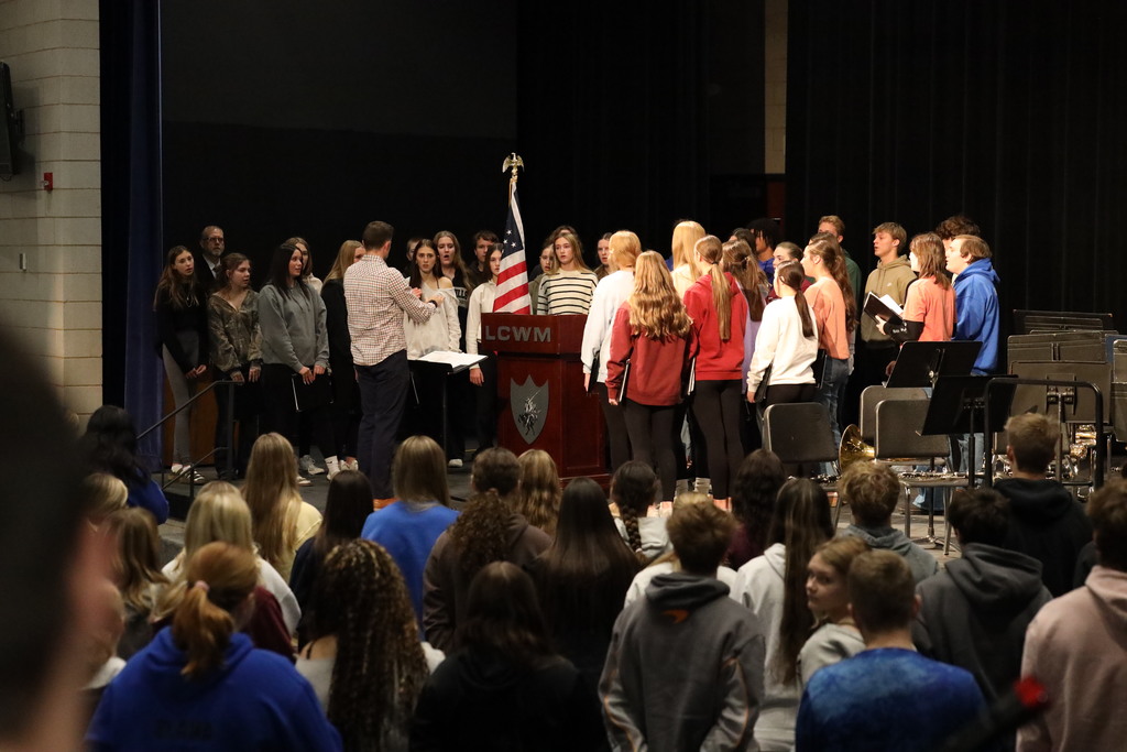 High school choir opening the assembly by singing the National Anthem. 