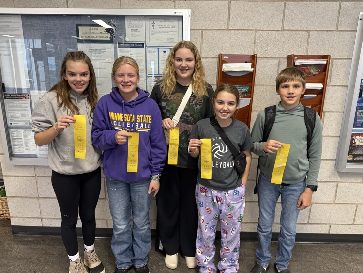 students holding fourth place ribbons after their knowledge bowl meet yesterday  