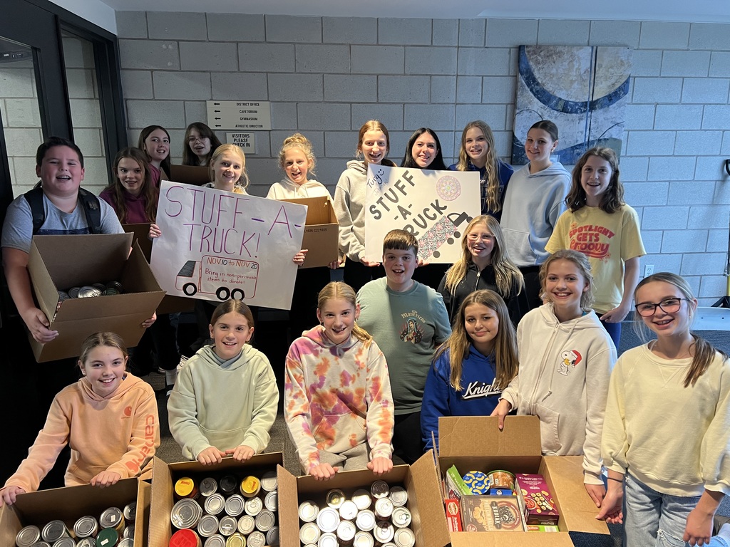Students with boxes of non perishable food to donate to the Lake Crystal food shelf.