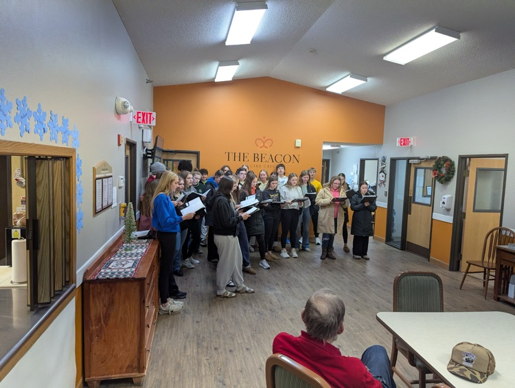 choir members singing at the nursing home in town. 