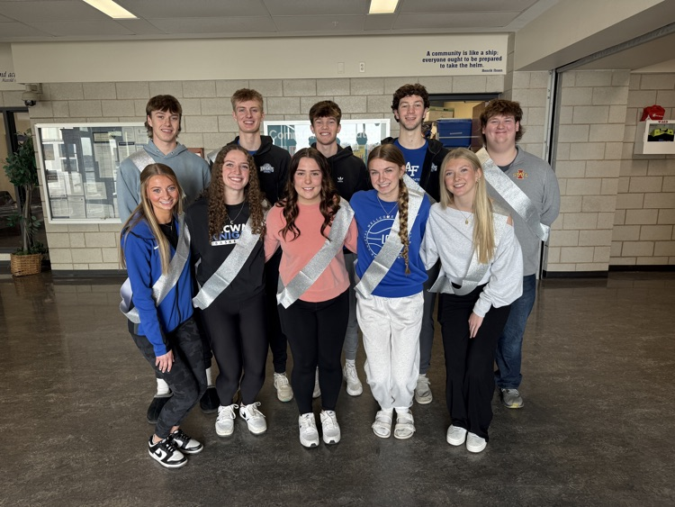 students who were nominated for snow week court lined up  smiling at the camera 