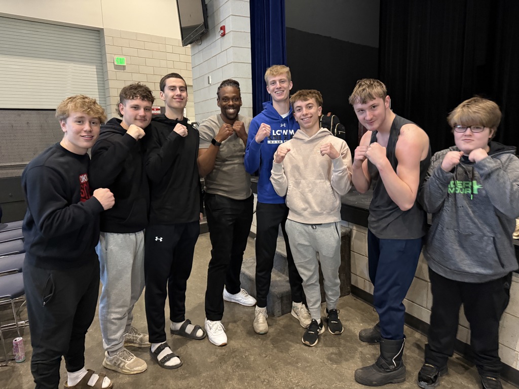 Students posing with Cam F. Awesome. 