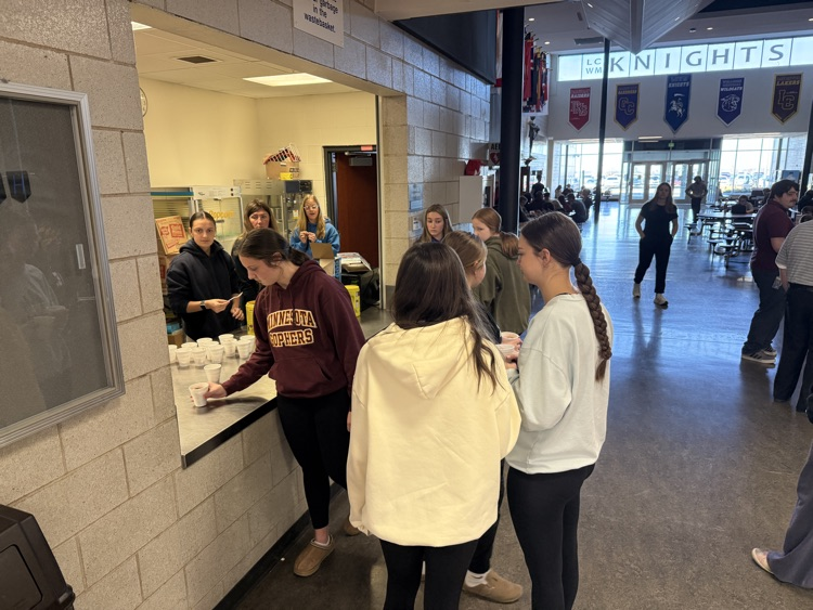 kids waiting in line at the concession stand for hot chocolate  