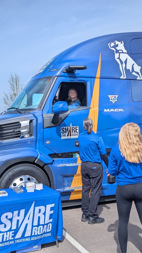 Student sitting in the driver seat of a semi to experience the blindspots like a semi driver does. 