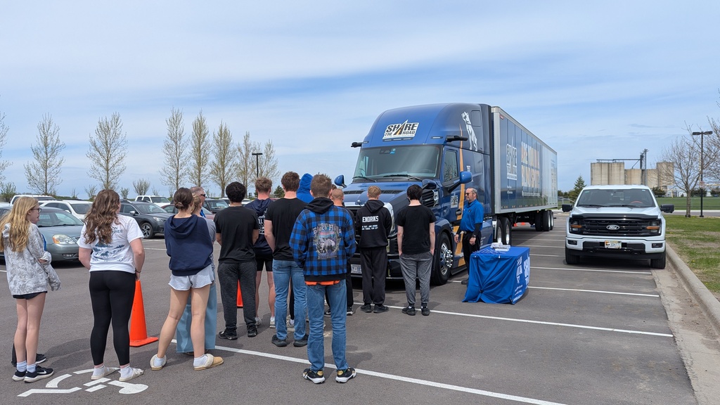 Students lined up outside of a semi, learning about semi blindspots.  