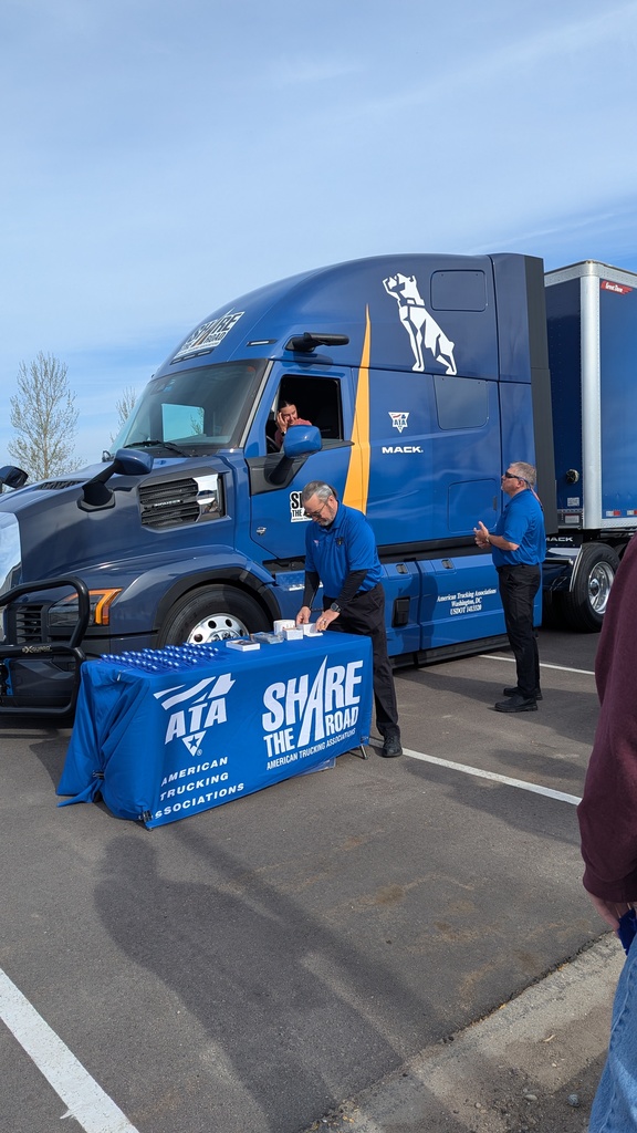 Student sitting in the driver seat of a semi to experience the blindspots like a semi driver does. 